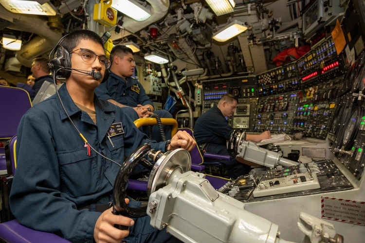 Military officer piloting a vehicle